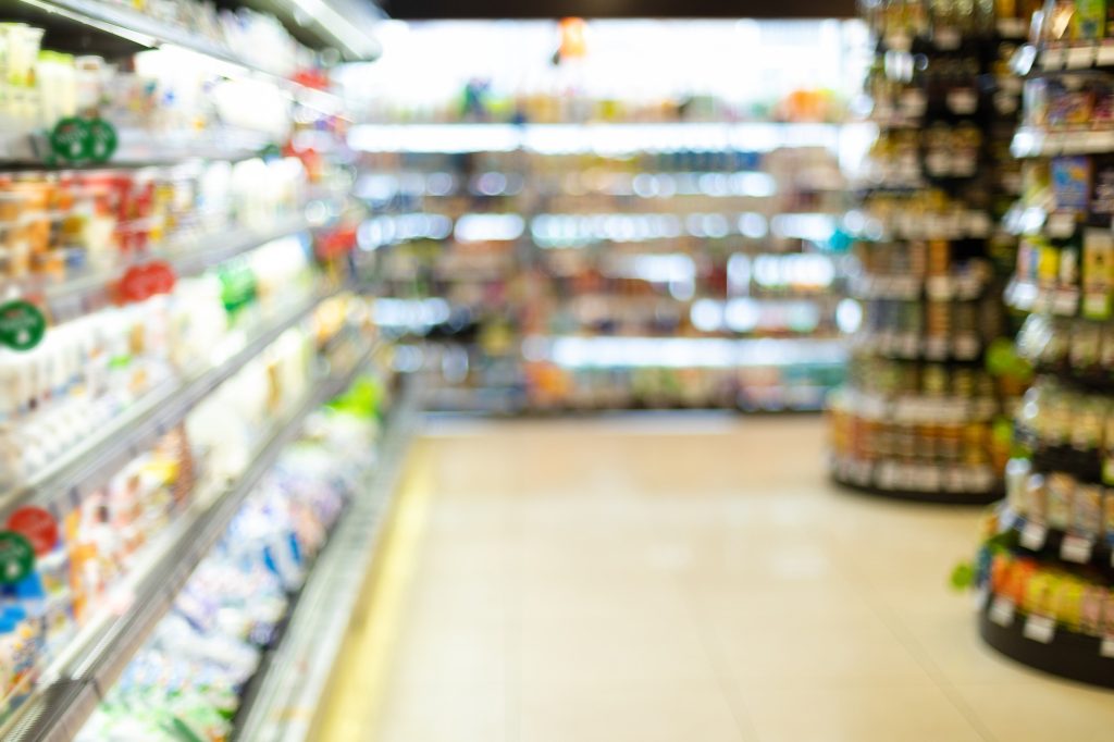 Blurry Supermarket Background, Grocery Store Aisle With Products On Shelves