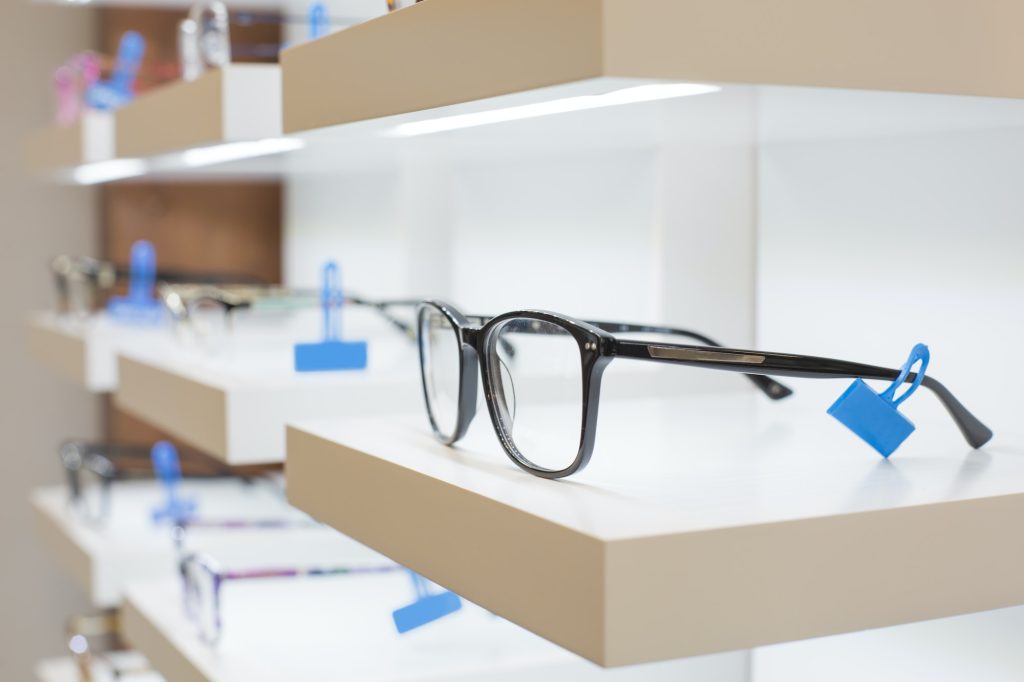 glasses on a shelf in a store
